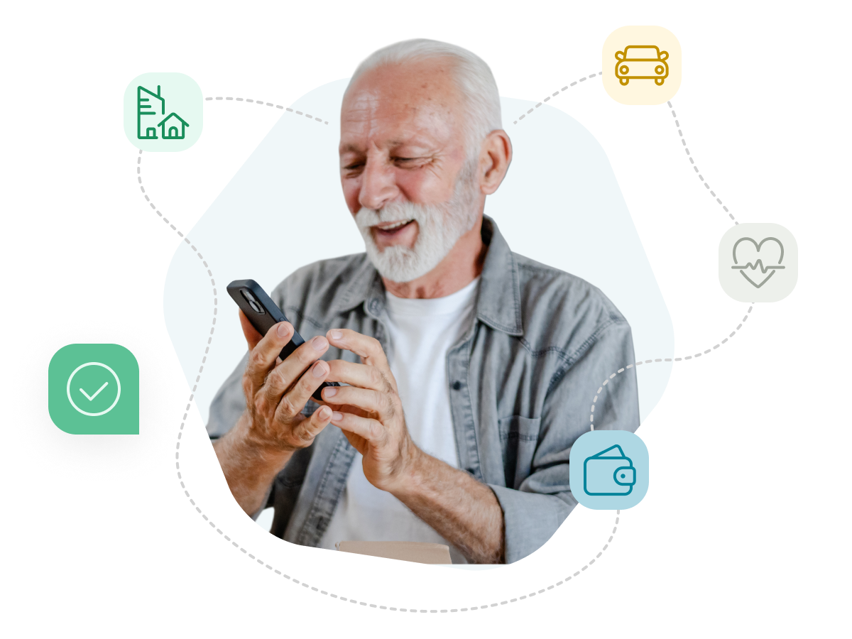 An older man with white hair and beard looking at his phone